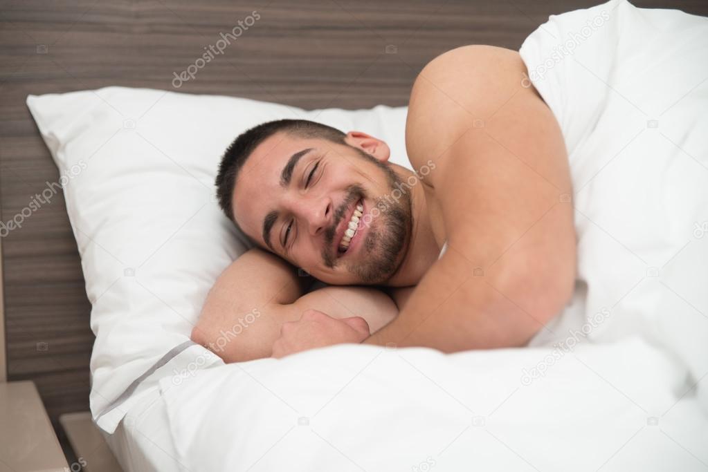 Happy Man Waking Up In His Bedroom