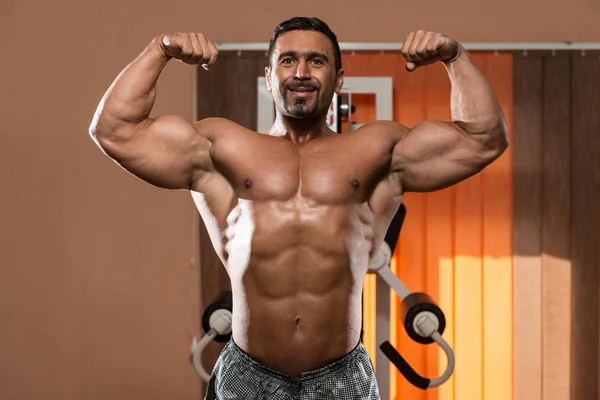 Dubbel Biceps utgör — Stockfoto