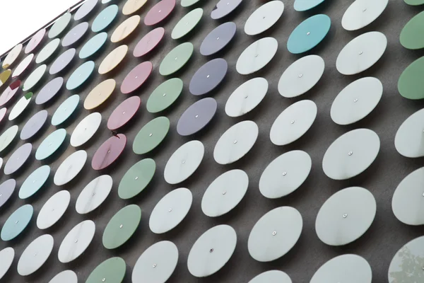 Modern Building Coated With Metallic Disc Pattern