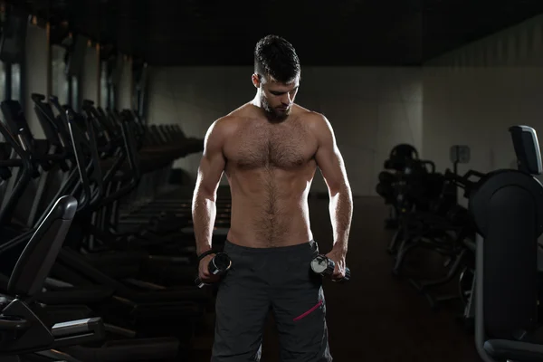 Young Man Exercising Biceps With Dumbbells — Stock Photo, Image