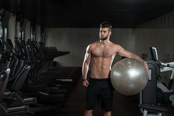Handsome Man With An Exercise Ball — Stock Photo, Image