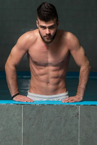 Young Looking Macho Man At Hotel Indoor Pool — Stock Photo, Image