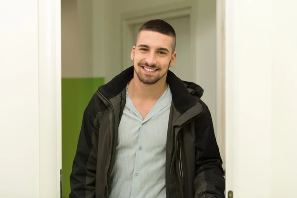 Young Man Entering Through His Front Door — Stock Photo, Image