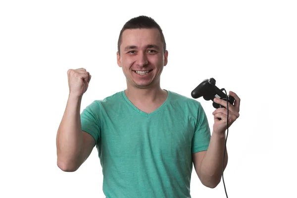 Homem concentrado jogando videogames em um fundo branco — Fotografia de Stock