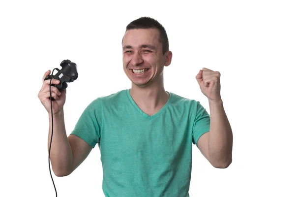 Homem concentrado jogando videogames em um fundo branco — Fotografia de Stock