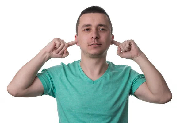 Stilig kille stänga öronen med fingrarna — Stockfoto