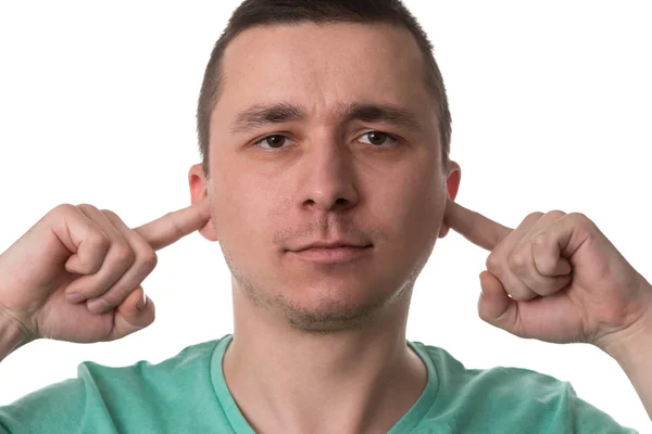 Stilig kille stänga öronen med fingrarna — Stockfoto