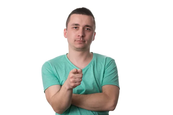 Casual ung man pekar ett finger mot kameran — Stockfoto
