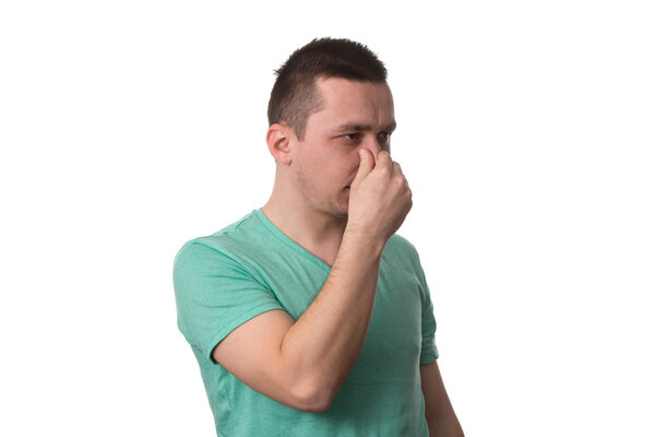 Man Touching His Nose And Has Unpleasant Pain