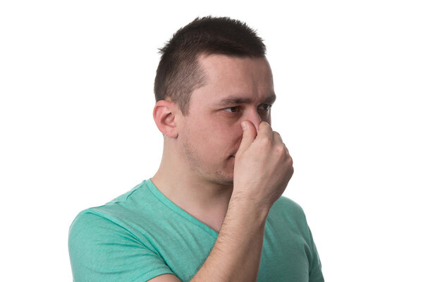 Man Touching His Nose And Has Unpleasant Pain
