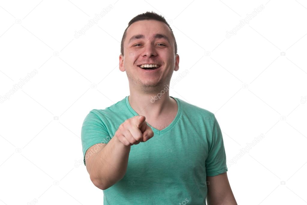 Casual Young Man Pointing A Finger Towards Camera