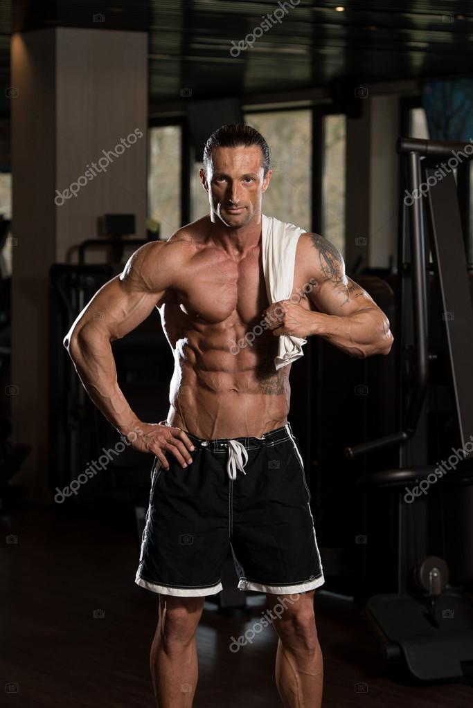 Hombre musculoso con una toalla en los hombros: fotografía de stock © ibrak  #72897871