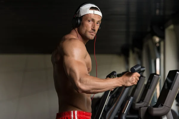 Mature Man Doing Aerobics Elliptical Walker In Gym — Stock Photo, Image