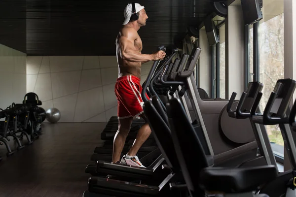 Mature Man Doing Aerobics Elliptical Walker In Gym — Stock Photo, Image