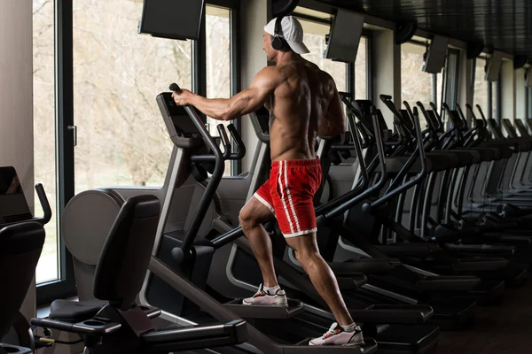Mature Man Doing Aerobics Elliptical Walker In Gym — Stock Photo, Image