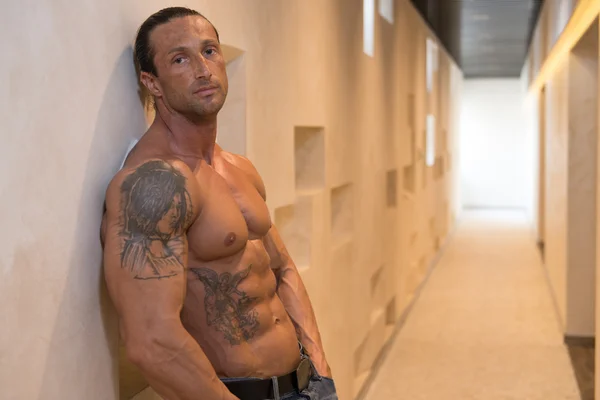 Handsome Man Poses In Modern Corridor — Stock Photo, Image