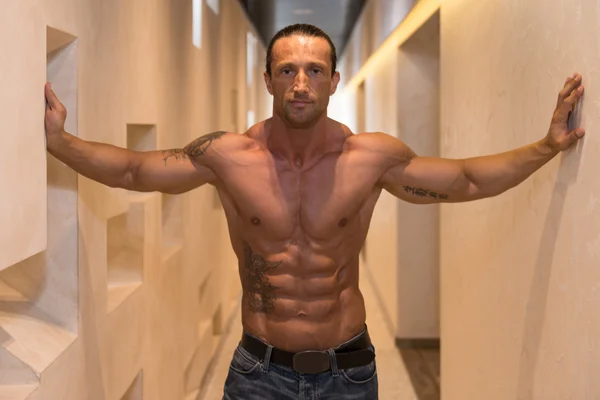 Handsome Man Poses In Modern Corridor — Stock Photo, Image