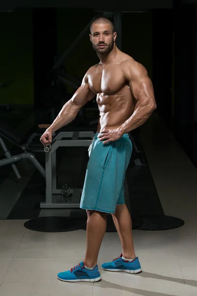 Young Man Flexing Muscles — Stock Photo, Image