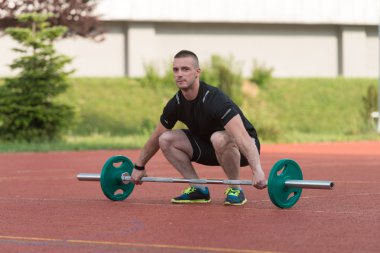 Young Man Doing A Overhead Squat Exercise Outdoor