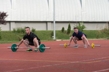 Young People Doing A Overhead Squat Exercise Outdoor