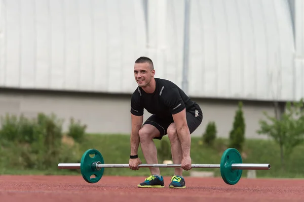 Healthy Young Man Doing Exercise For Back Outdoor — Stock Photo, Image