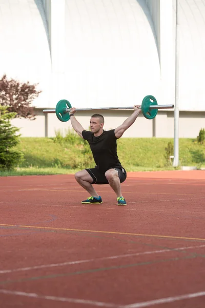 Young Man Doing A Overhead Squat Exercise Outdoor — Zdjęcie stockowe