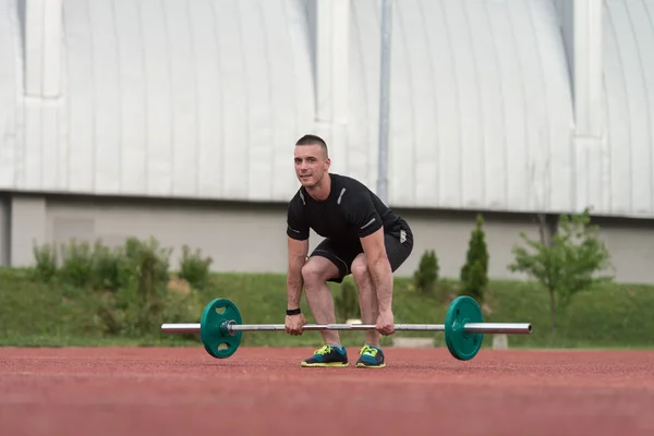 Young Man Doing A Deadlift Exercise Outdoor — Zdjęcie stockowe