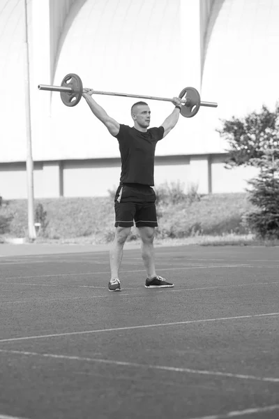 Young Man Doing A Overhead Squat Exercise Outdoor — Zdjęcie stockowe