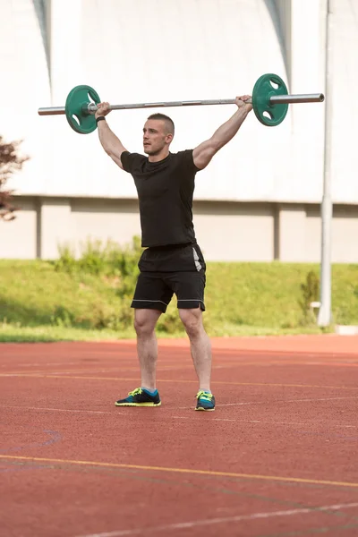 Young Man Doing A Overhead Squat Exercise Outdoor — Stockfoto