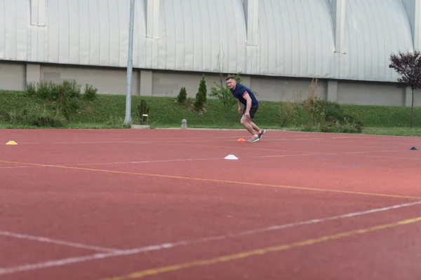 Athlete Running To The Cone — Stok fotoğraf