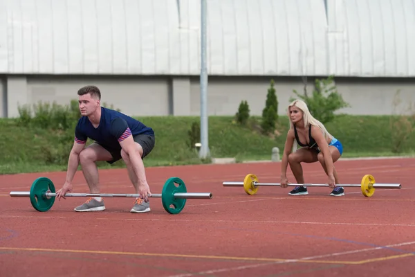 Young People Doing Bent Over Barbell Row Exercise — 图库照片