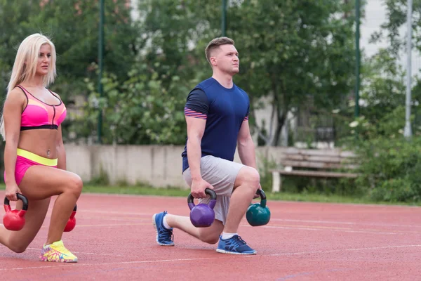 Young People Doing Kettle Bell Exercise Outdoor — Φωτογραφία Αρχείου