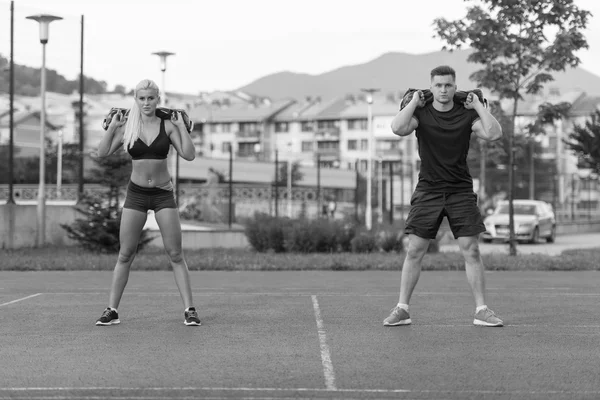 Group Of People Doing Bag Squat Exercise Outdoor — 图库照片