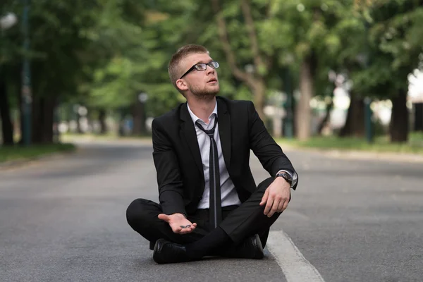 Businessman Sitting On Asphalt Begs For Money — Stock Photo, Image