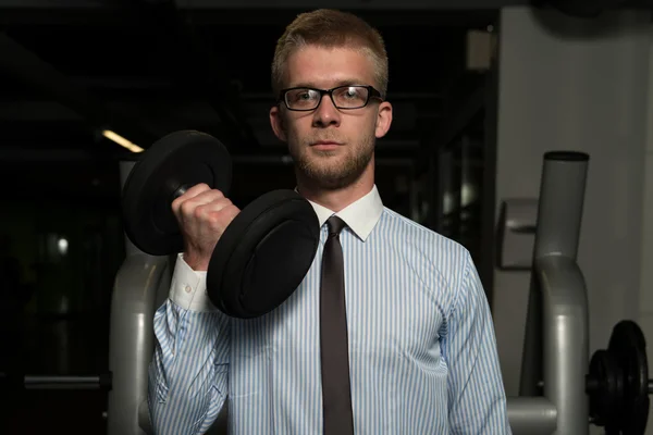 Businessman Exercising Biceps With Dumbbells — Stock Photo, Image