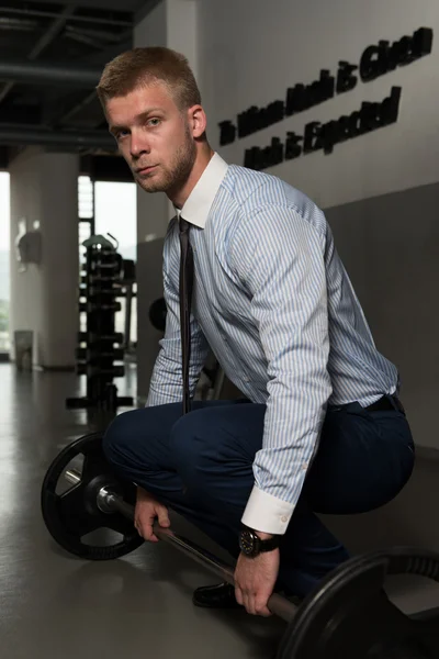Jeune homme d'affaires en santé faisant de l'exercice pour le dos — Photo