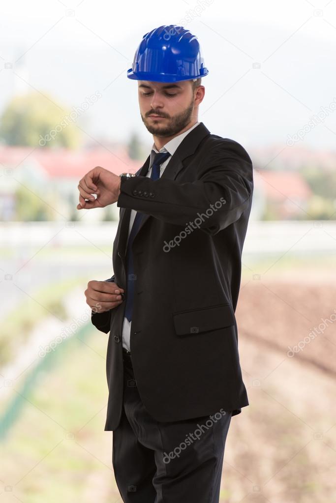 Handsome Construction Manager Looking At His Watch