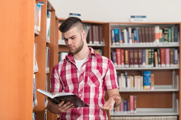 Funny and Crazy Man Reading From Book — стоковое фото