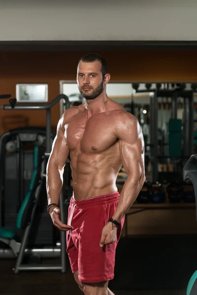 Young Man Flexing Muscles — Stock Photo, Image