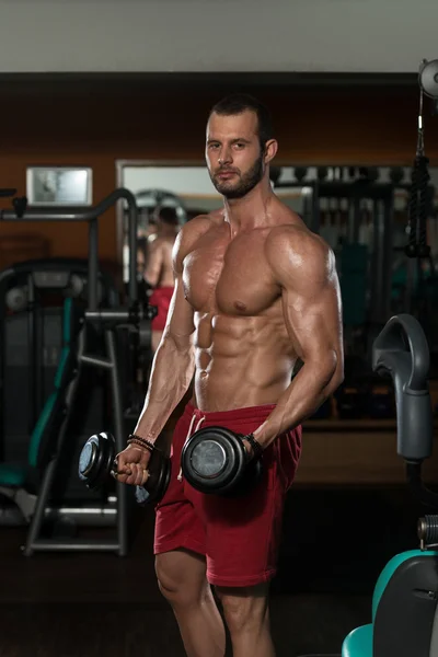 Muscular Man Doing Heavy Weight Exercise For Biceps — Stock Photo, Image