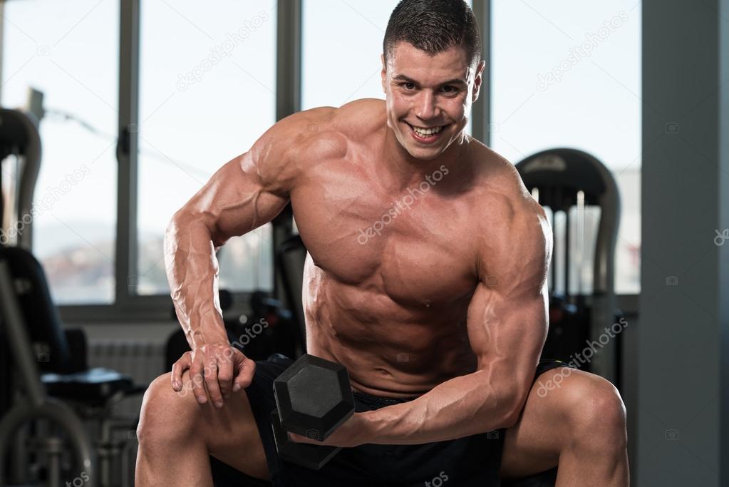 Bodybuilder Exercise With Dumbbells