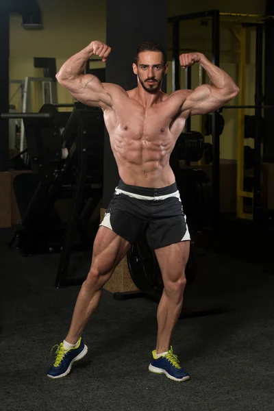 Muscular Men Is Hitting Rear Double Bicep Pose — Stock Photo, Image