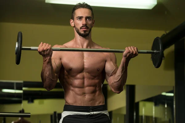 Bodybuilder Performing Biceps Curls With A Barbell — Stock Photo, Image