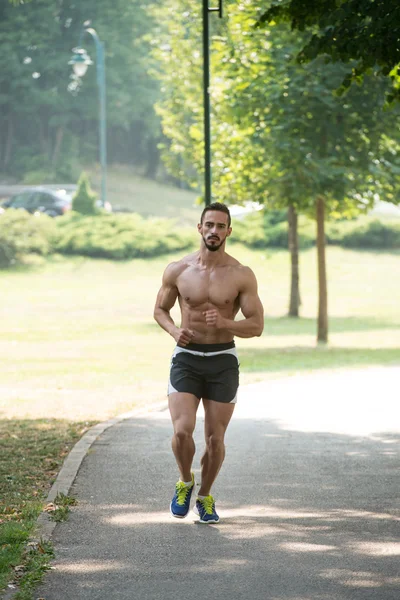 Bodybuilder Runner Jogging Under Utomhusträning I Park — Stockfoto