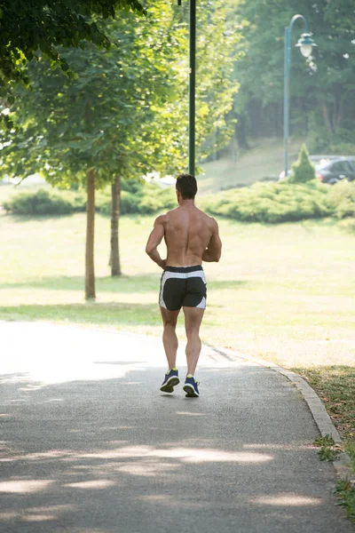 Bodybuilder Hardlopen Buiten Proberen gewichtsverlies — Stockfoto