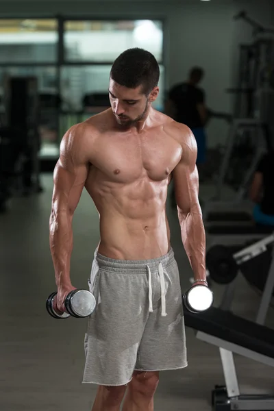 Young Man Doing Exercise For Biceps — Stock Photo, Image