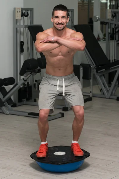 Young Man Exercising - Bosu Balance Ball — Stock Photo, Image