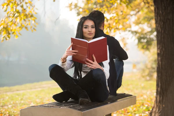 Couple Enjoying Book And Digtial Tablet Touchpad — Stock Photo, Image