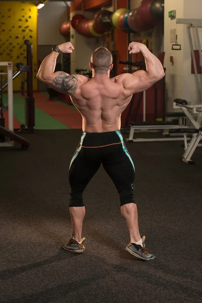 Muscular Men Is Hitting Rear Double Bicep Pose — Stock Photo, Image