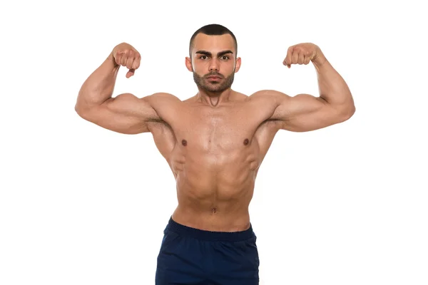 Muscular halterofilista homem posando sobre fundo branco — Fotografia de Stock